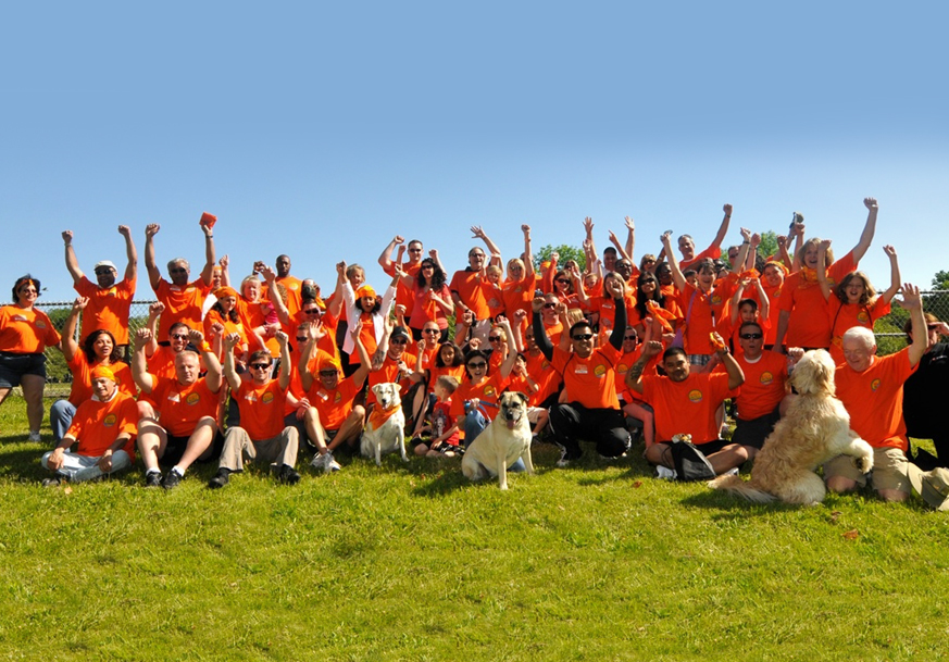 A large group of volunteers at a charity event